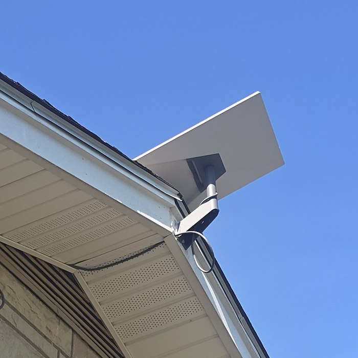 Starlink satellite dish installation on roofline